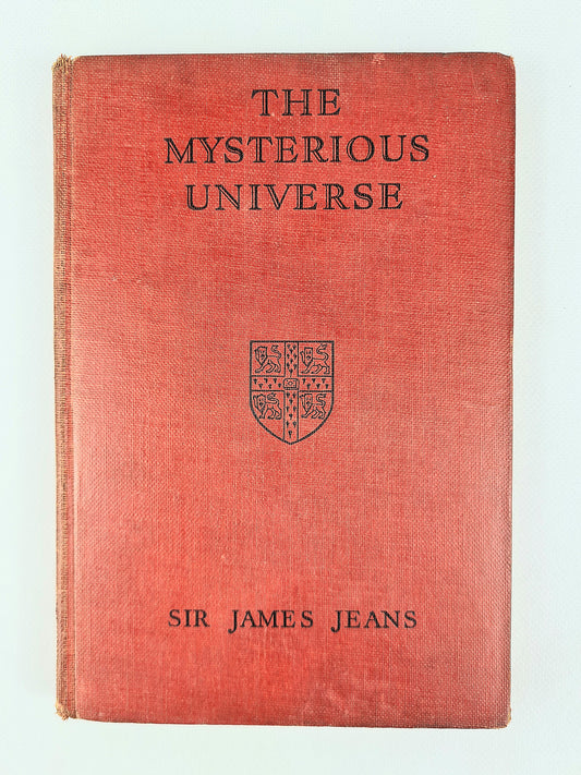 Red Hardback antique science book. The Mysterious Universe 