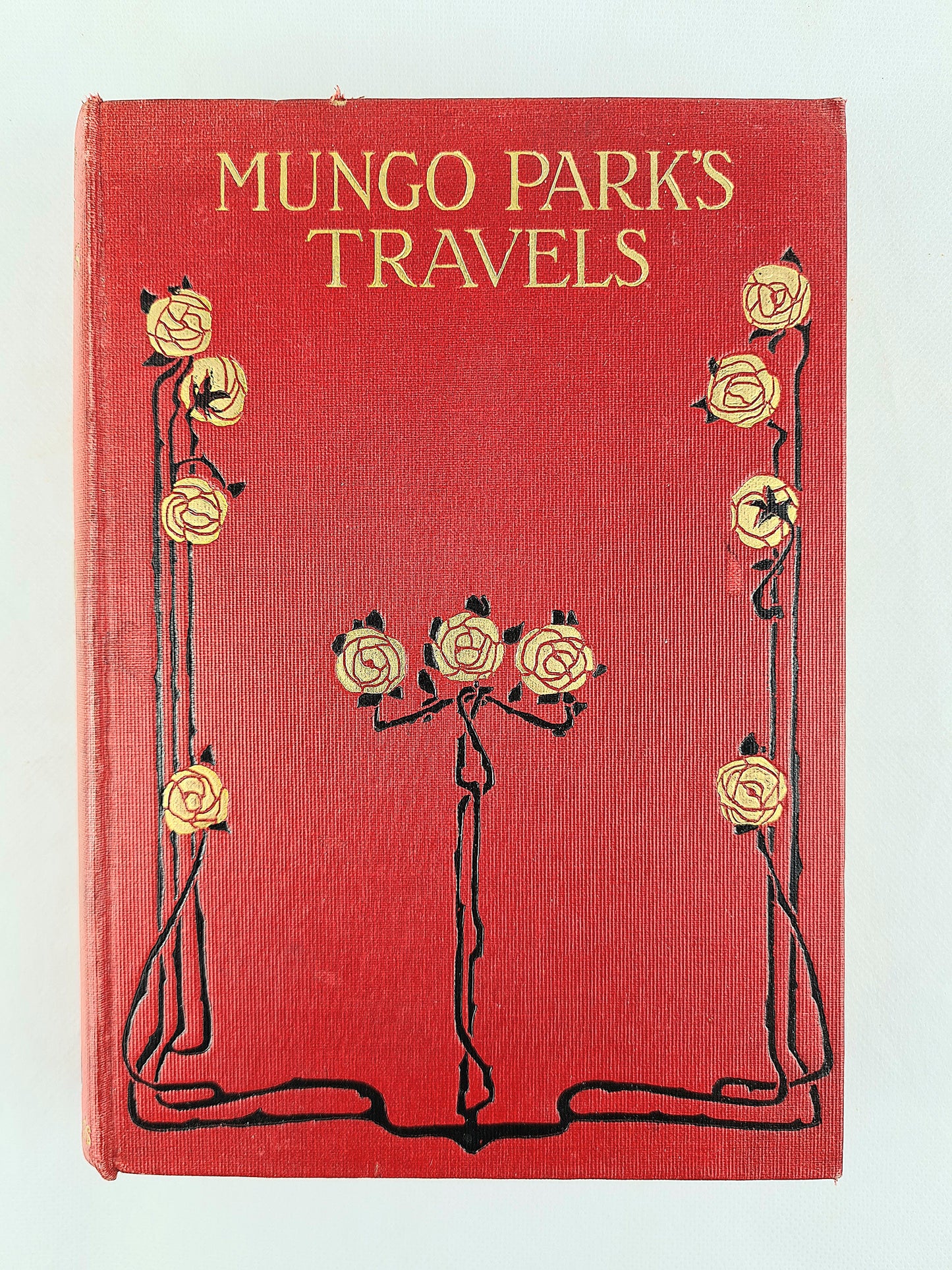 Mungo parks travels. Decorative antique book. Red and gilt cover design