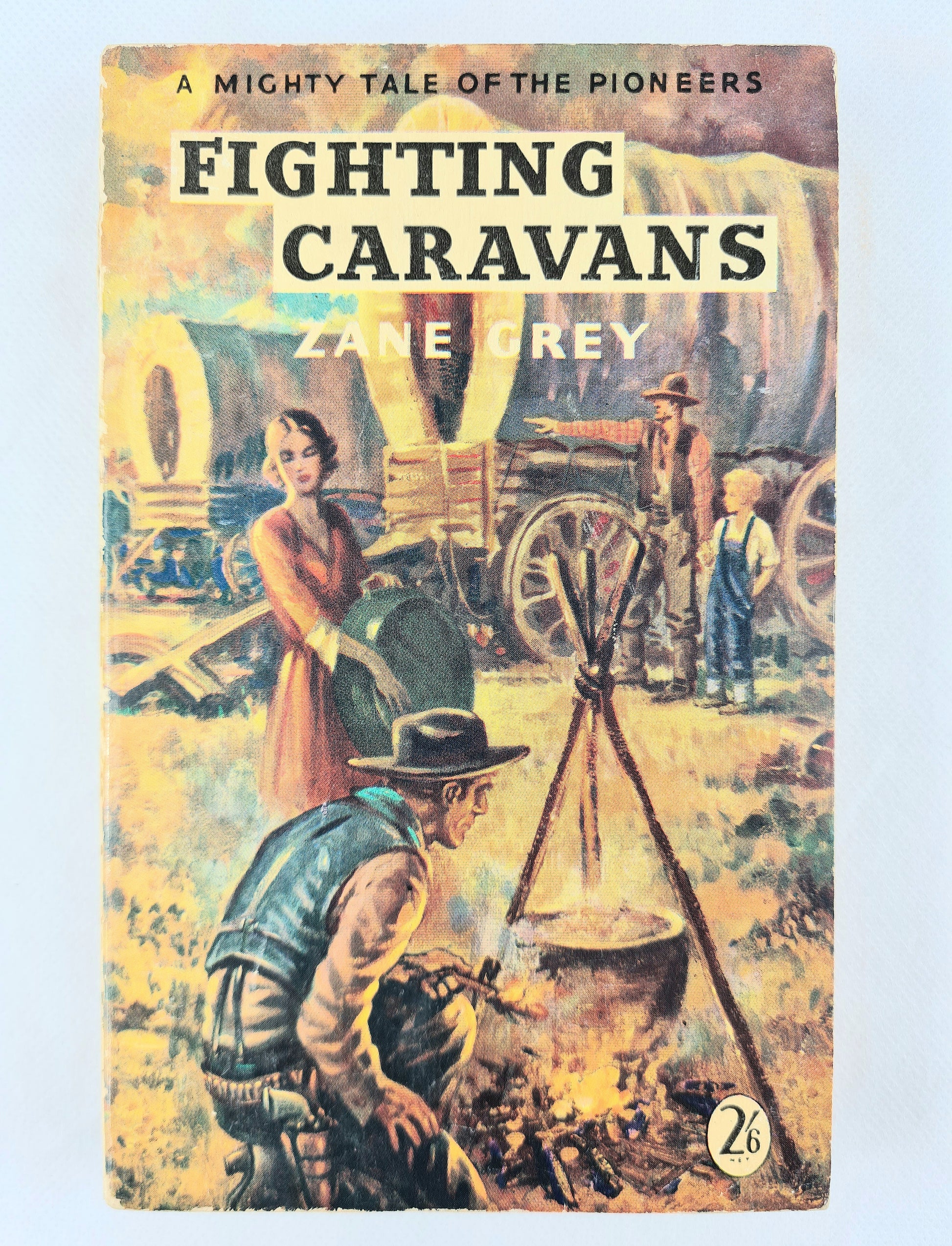 Book cover of 'Fighting Caravans' by Zane Grey with a vintage illustration of pioneers.