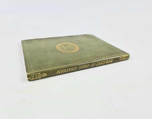 Vintage green book with gold embossed lettering on a white background