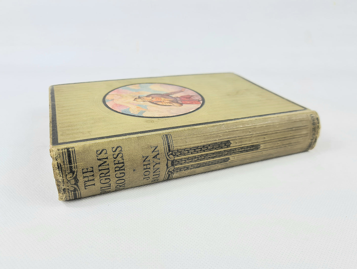 Antique book the pilgrims progress by John Bunyan.