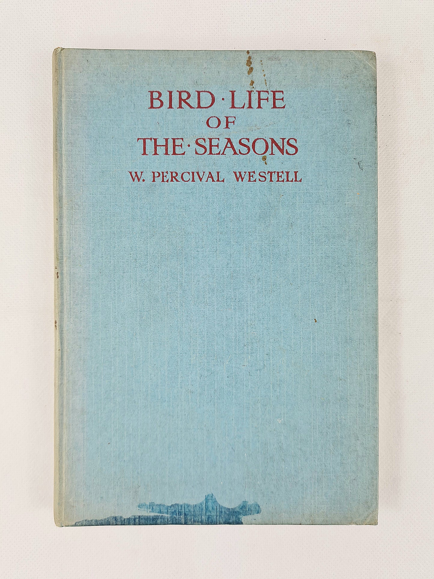 Book cover of 'Bird Life of the Seasons' by W. Percival Westell with a light blue background.
