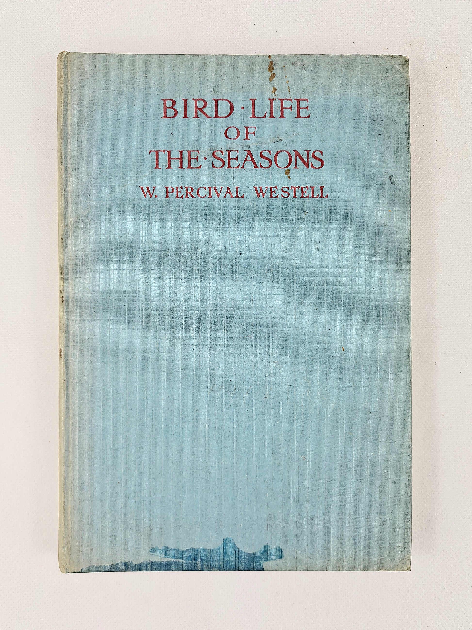 Book cover of 'Bird Life of the Seasons' by W. Percival Westell with a light blue background.
