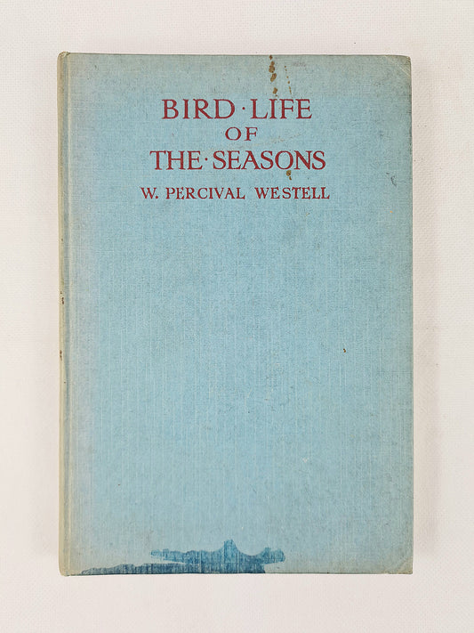 Book cover of 'Bird Life of the Seasons' by W. Percival Westell with a light blue background.