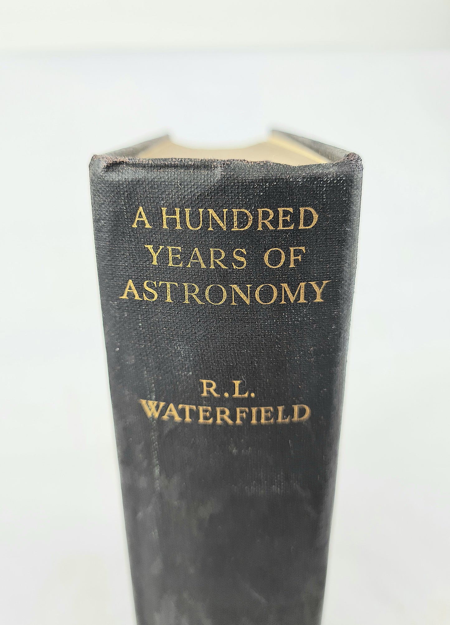 Black antique book with gold lettering 