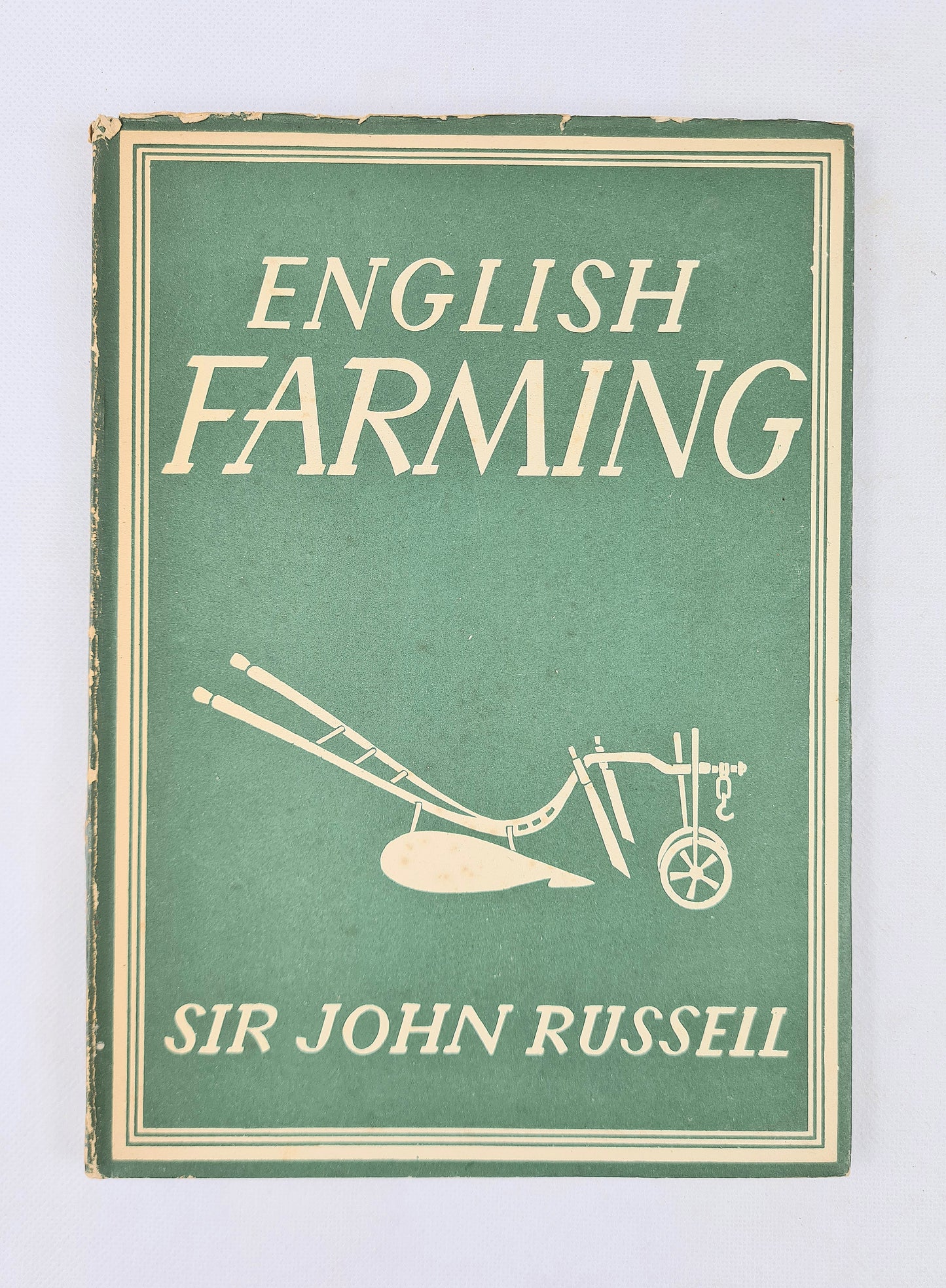 Book cover of 'English Farming' by Sir John Russell with a green background and white text.