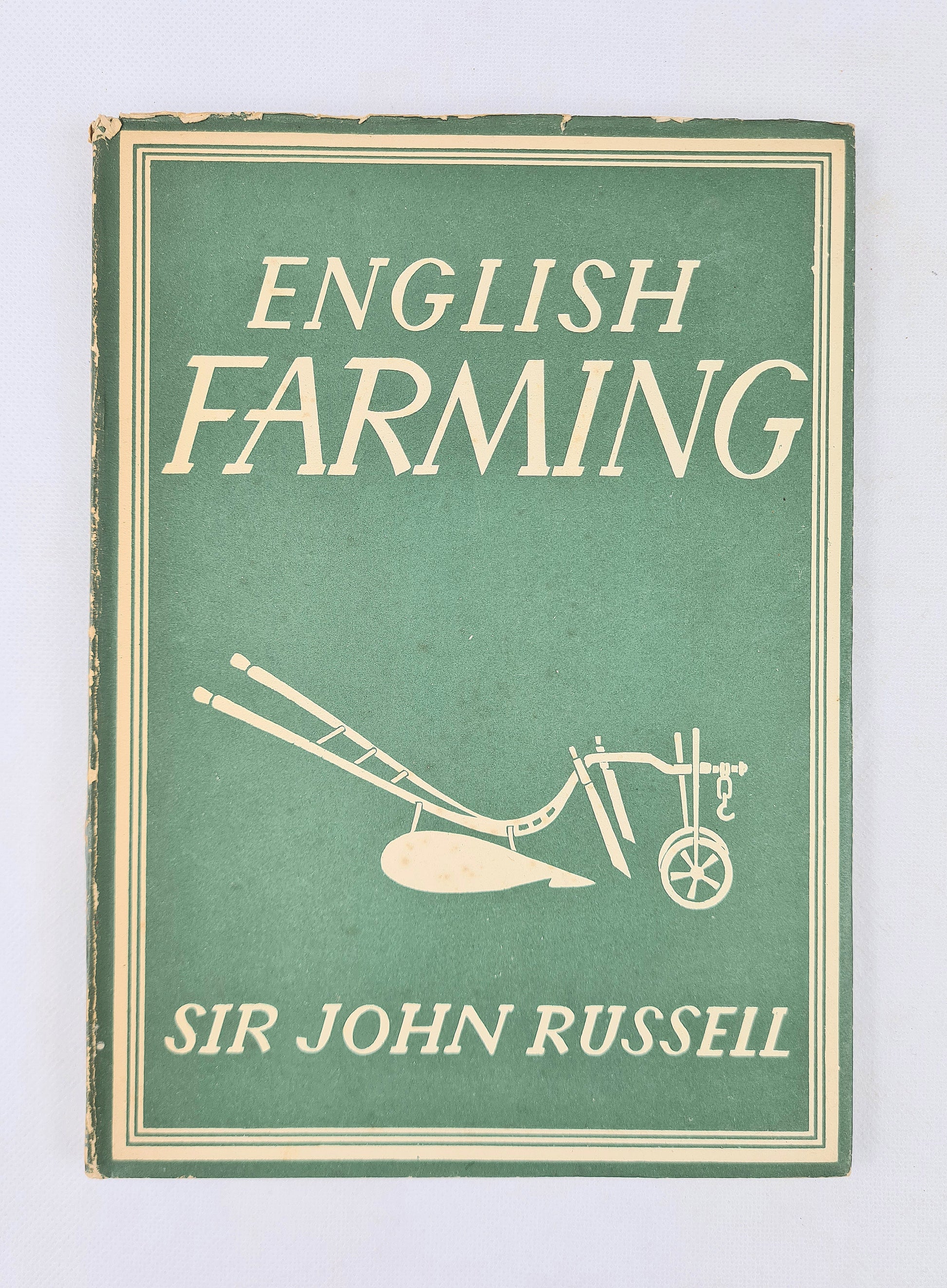 Book cover of 'English Farming' by Sir John Russell with a green background and white text.