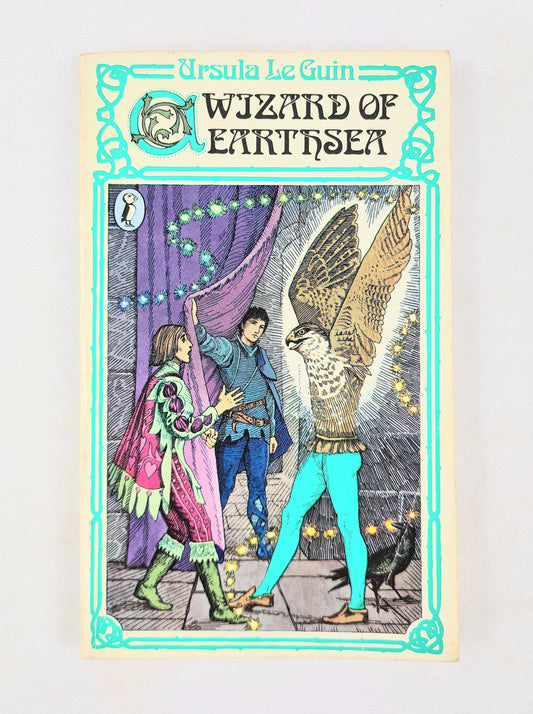 Book cover of 'Wizzard of Earthsea' by Ursula Le Guin with illustrations of characters and a winged creature.