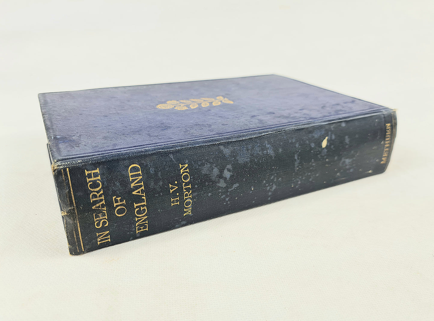 Blue antique book on a white background. In search of england 