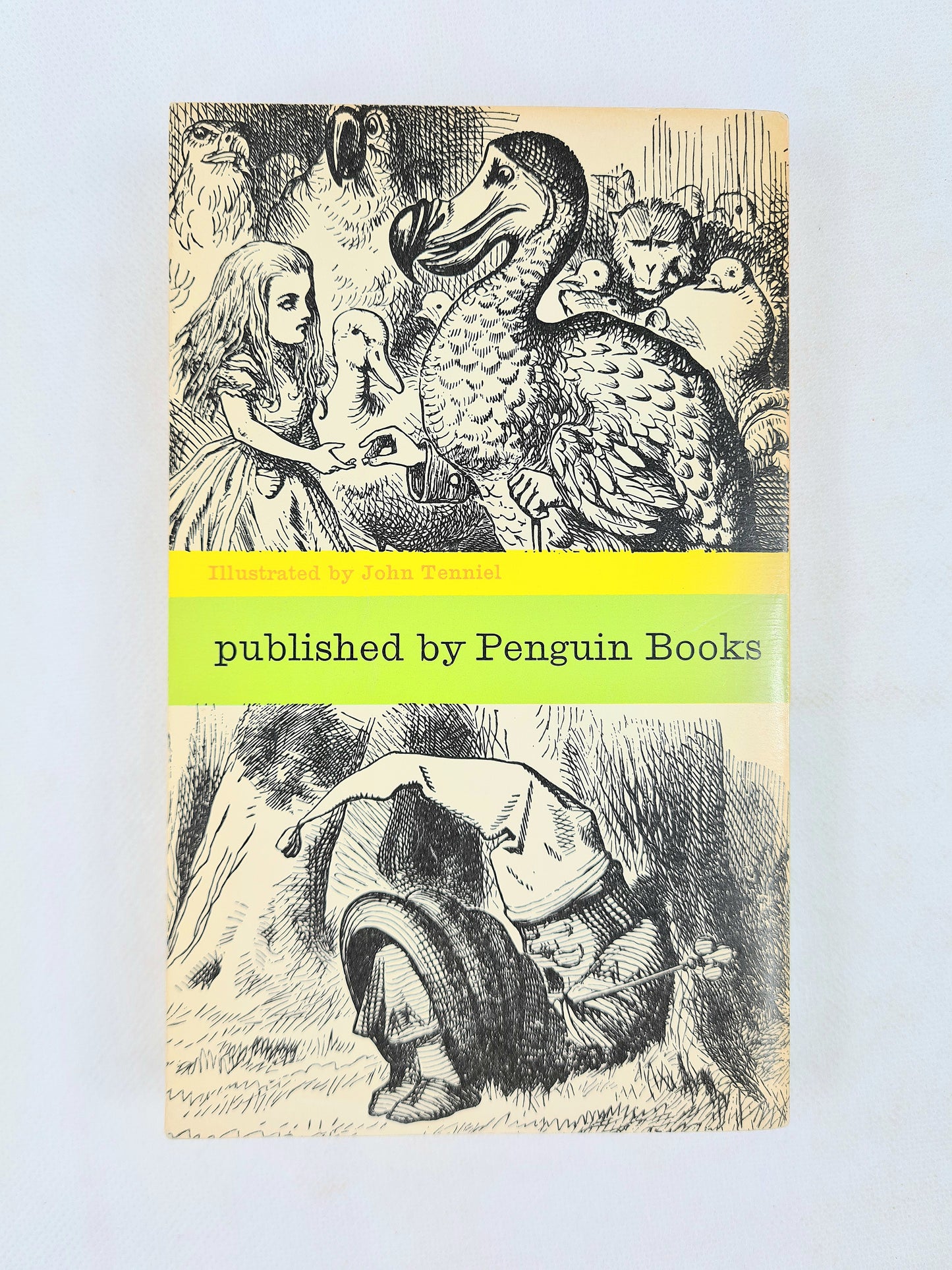 Alice's Adventures in Wonderland  and Through The Looking Glass by Lewis Caroll. An Illustrated vintage children's Puffin book.