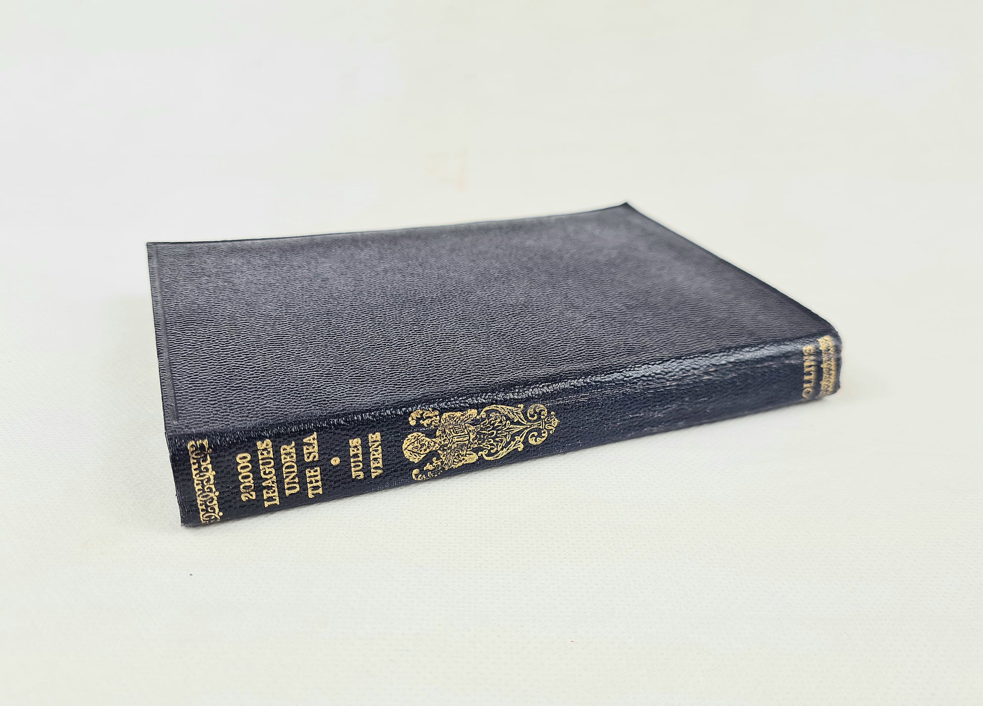 Blue book with gold text on a white background