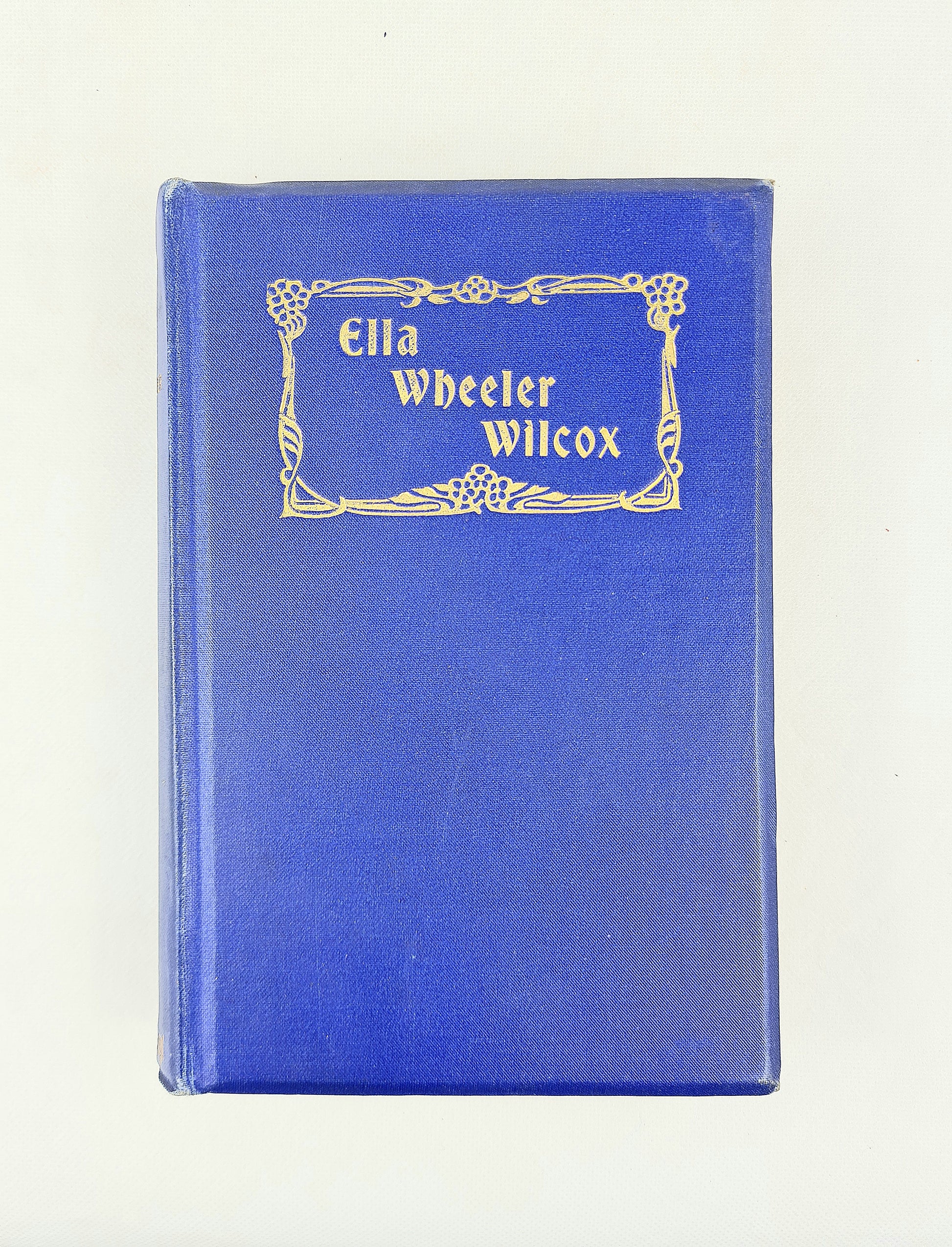 Blue book with 'Ella Wheeler Wilcox' on a white background