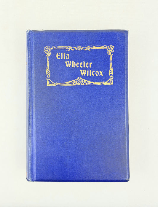 Blue book with 'Ella Wheeler Wilcox' on a white background