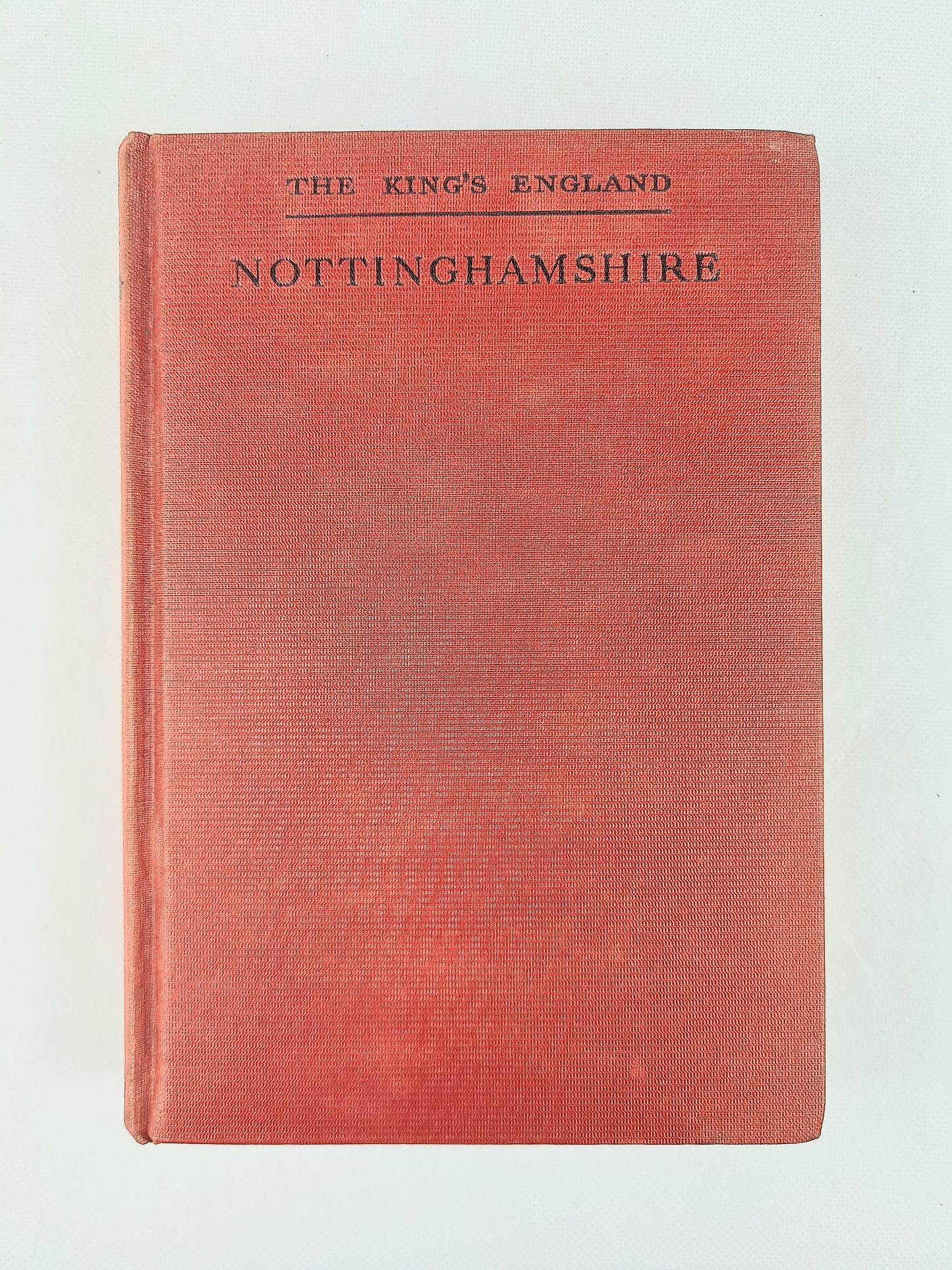 A vintage hardcover book titled 'The King's England Nottinghamshire' with a textured red cover and black printed text, shown against a plain off-white background.