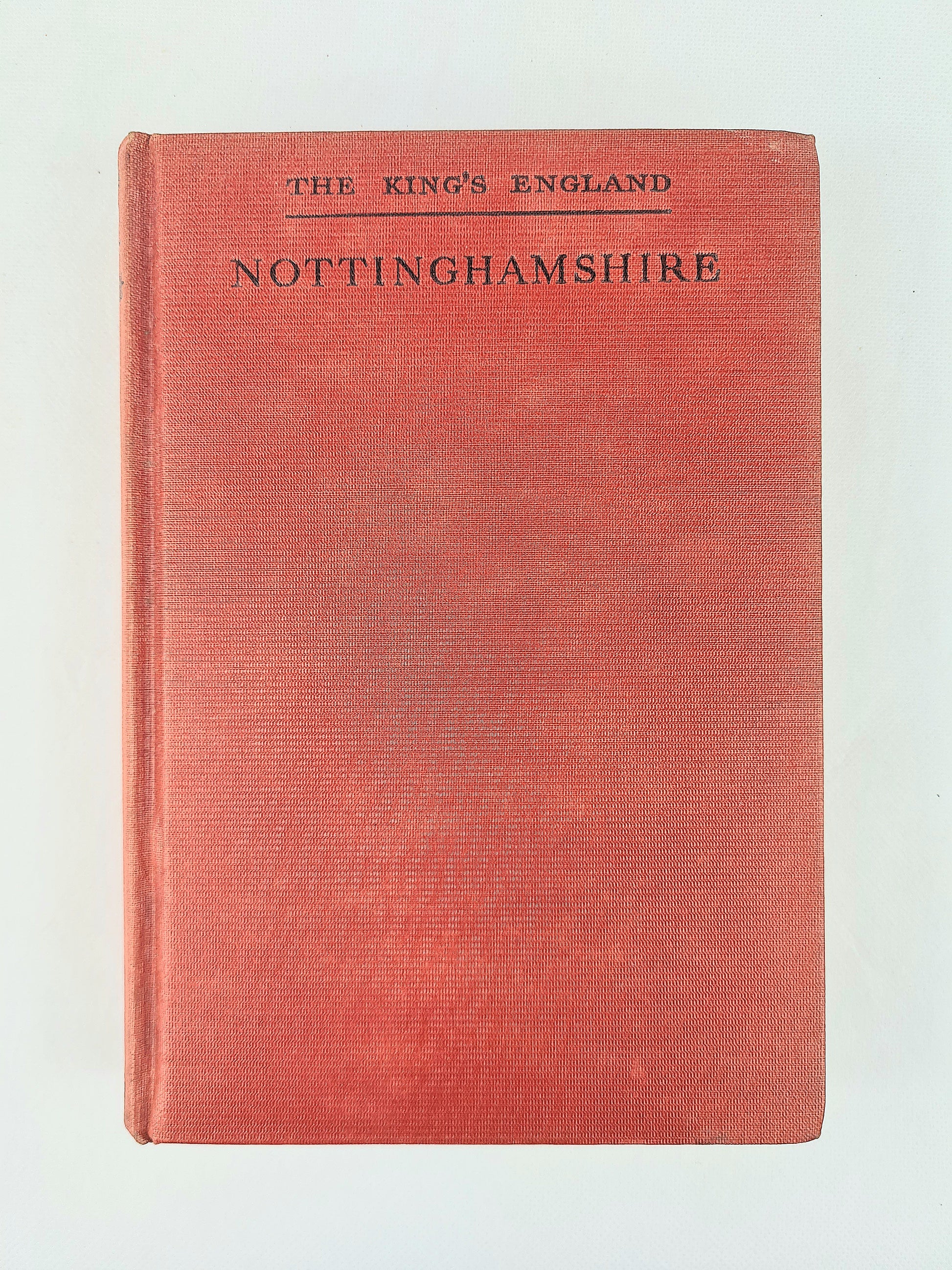 A vintage hardcover book titled 'The King's England Nottinghamshire' with a textured red cover and black printed text, shown against a plain off-white background.