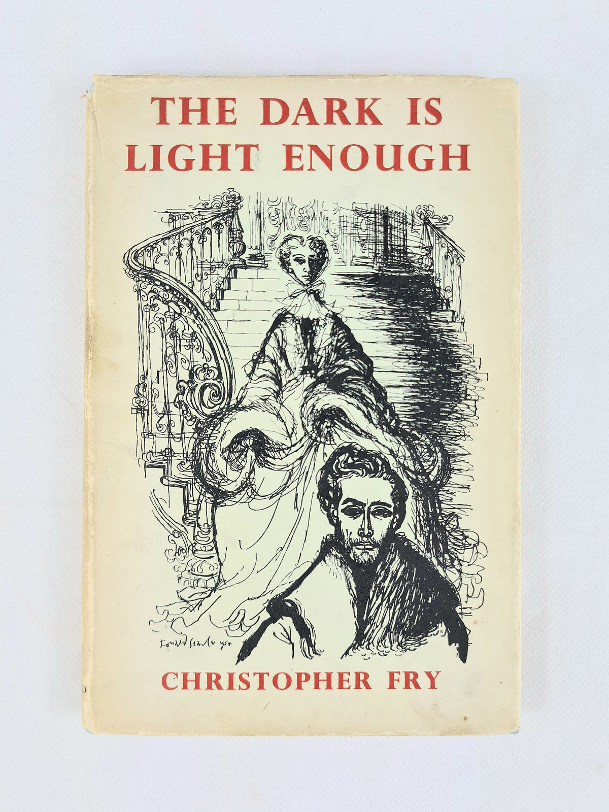 Vintage book cover for 'The Dark Is Light Enough' by Christopher Fry, featuring a cream-colored background with red title text and a black-and-white illustration of a woman on a staircase.