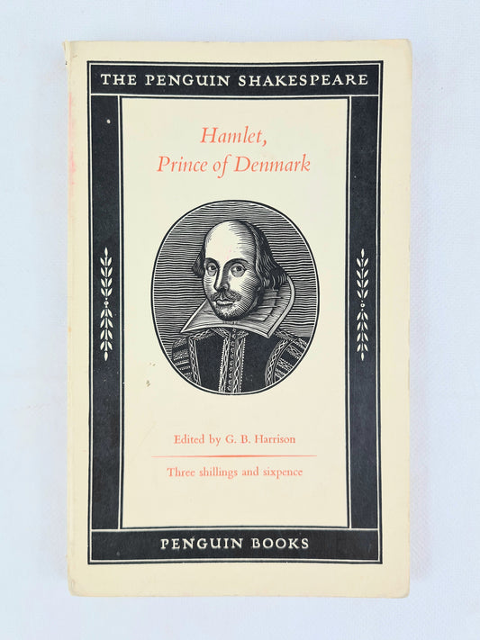 Front cover of vintage Penguin Shakespeare paperback Hamlet, Prince of Denmark, showing black border design and woodcut portrait of Shakespeare