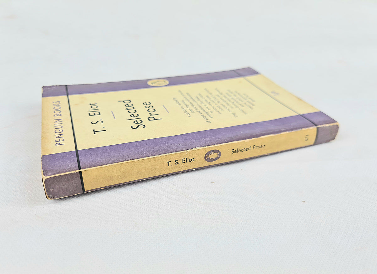 Back cover of T. S. Eliot Selected Prose Penguin paperback with author biography, purple and cream design and bookseller sticker