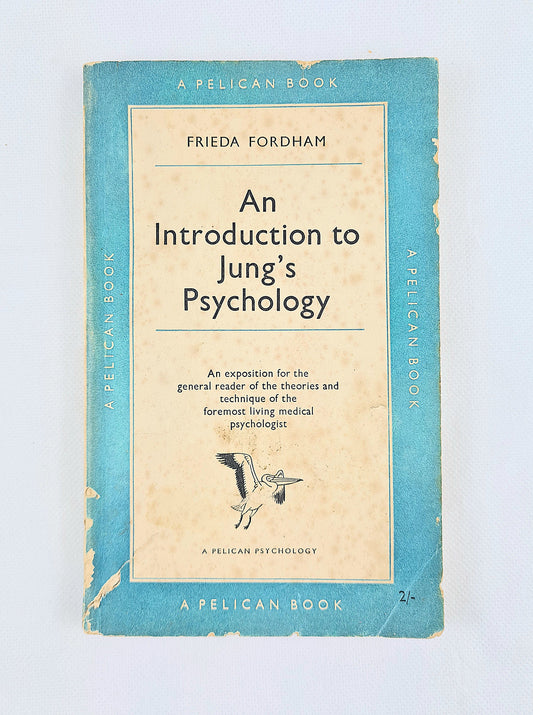 A vintage paperback book titled 'An Introduction to Jung's Psychology' by Frieda Fordham, published by Pelican. The cover features a light blue border with a cream-colored center panel containing the title and a small black-and-white stork illustration.