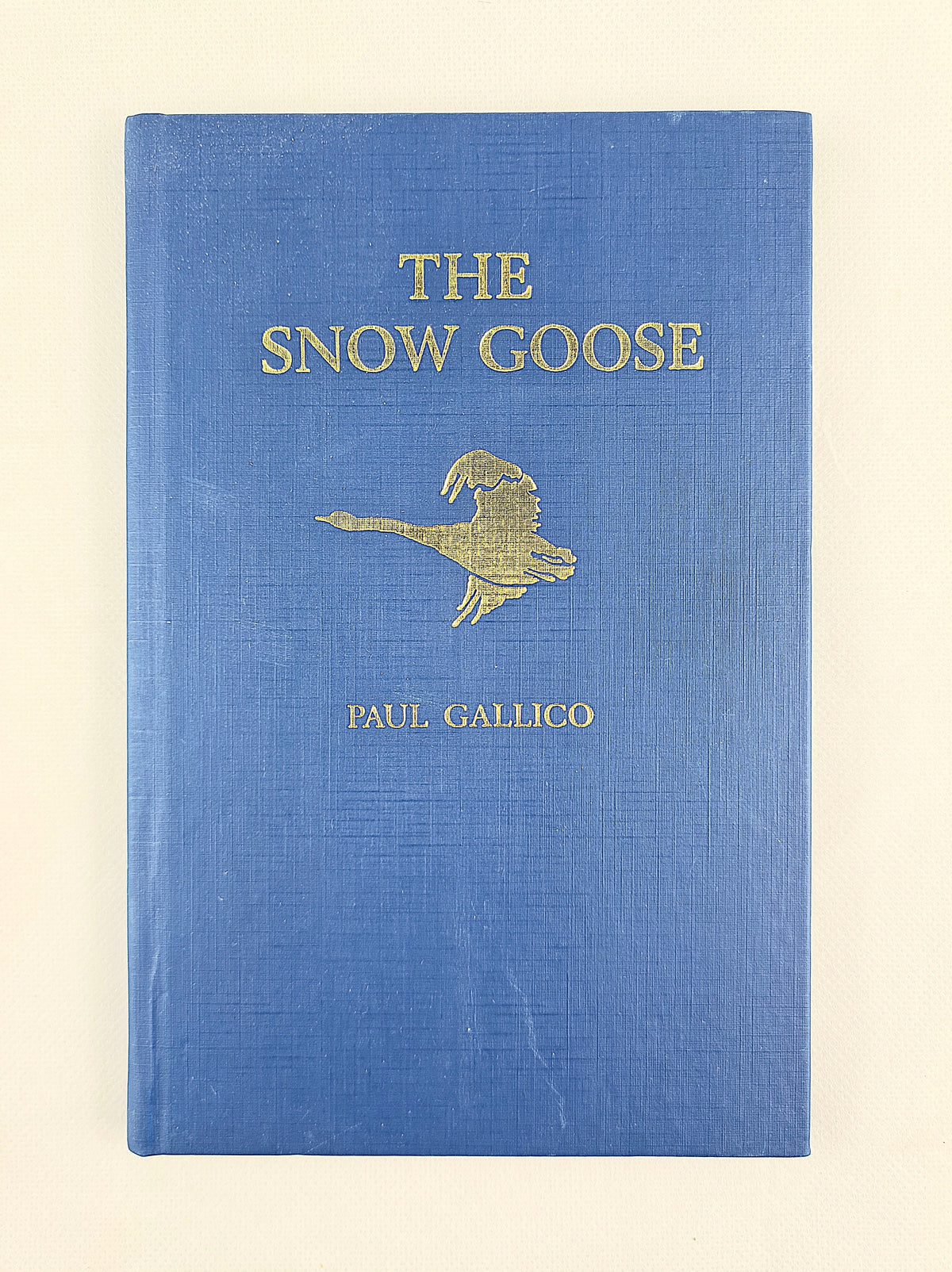 The snow goose by paul gallico. Vintage hardback book on a white background 