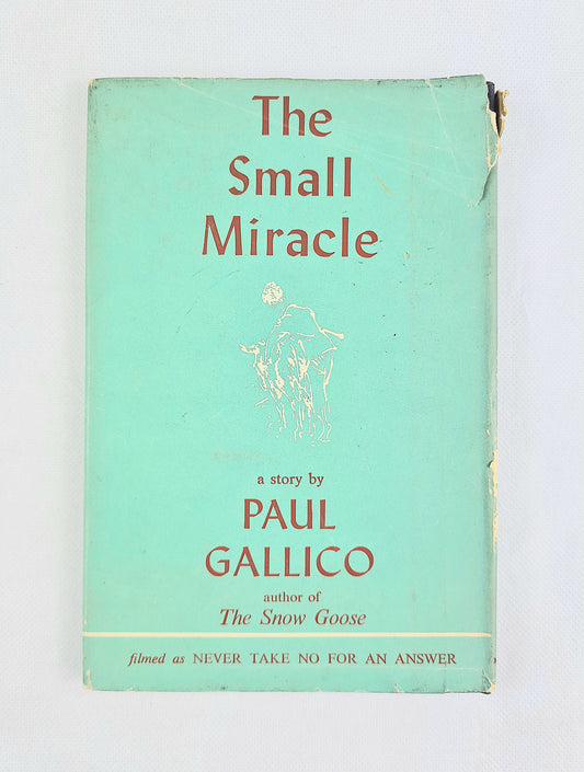 The small miracle by paul gallico. Vintage hardback book on a white background 